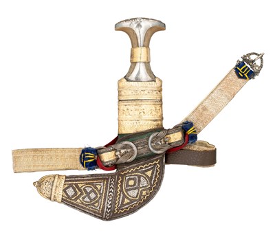 Lot 165 - AN ARAB DAGGER (JAMBIYA) WITH SILVER-GILT MOUNTED RHINOCEROS HORN HILT, EARLY 20TH CENTURY