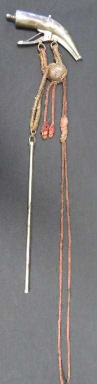 Lot 70 - A PERSIAN POWDER-FLASK AND RAMROD