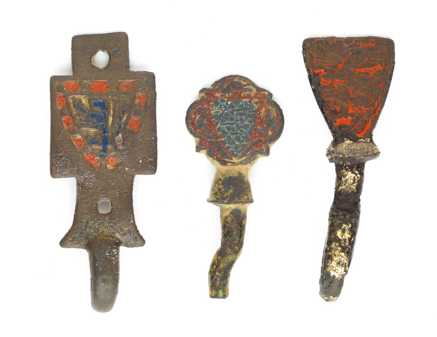 Lot 227 - TWO MEDIEVAL COPPER-ALLOY AND ENAMEL HORSE-HARNESS HERALDIC MOUNTS