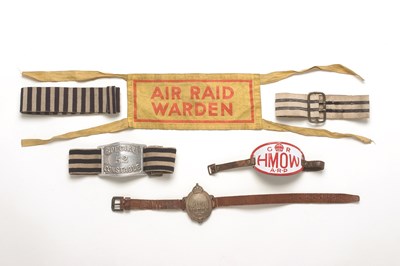 Lot 54 - SIX POLICE AND OTHER ARM BANDS comprising a WWII ARP enamelled arm badge; two blue and white striped