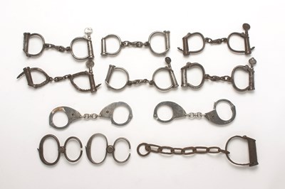 Lot 58 - TEN PAIRS OF HANDCUFFS comprising a pair by Hiatt dated 1960; an unusual pair by Hiatt marked patent
