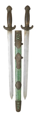 Lot 24 - **A PAIR OF CHINESE QUING DYNASTY HORN AND BRASS-MOUNTED SWORDS