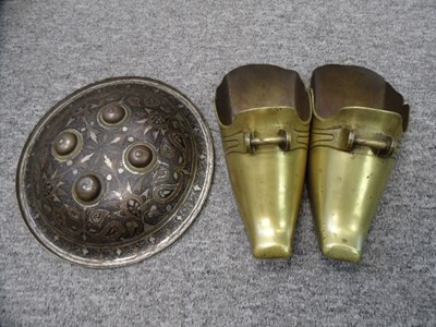 Lot 74 - A PAIR OF PERUVIAN BRASS STIRRUPS AND AN INDIAN SHIELD (DHAL)