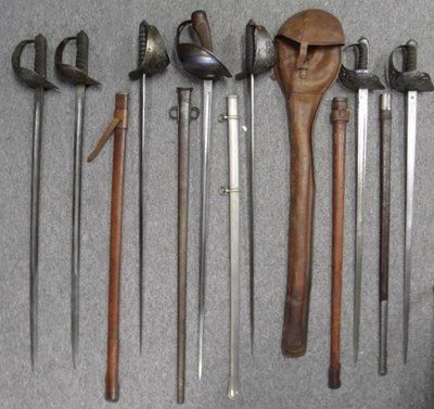 Lot 120 - A 1908 PATTERN CAVALRY SWORD AND SIX 1897 PATTERN INFANTRY SWORDS