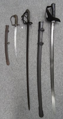 Lot 135 - A CAVALRY SWORD FOR A BOY AND TWO CONTINENTAL REGULATION SWORDS