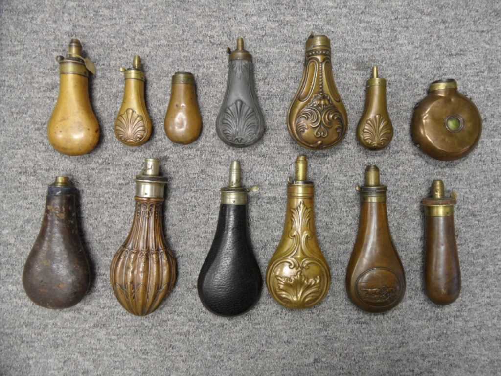 Powder Shot Flask Lot 163 - A LARGE COLLECTION OF POWDER AND SHOT-FLASKS