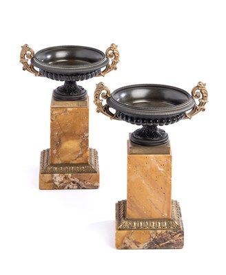 Lot 54 - A PAIR OF FRENCH PARCEL-GILT BRONZE TAZZE ON MARBLE PEDESTALS, PROBABLY PARIS, 19TH CENTURY