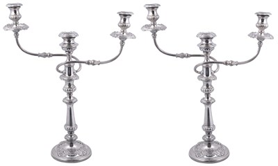 Lot 211 - A PAIR OF GEORGE III SILVER AND SHEFFIELD PLATE CANDELABRA