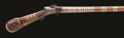 Lot 44 - AN INDIAN SILVER-MOUNTED MATCHLOCK MUSKET