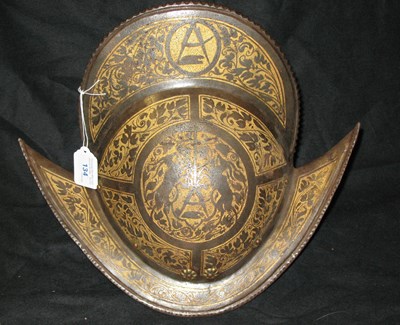 Lot 134 - AN ETCHED AND GILT MORION DECORATED WITH THE ARMS OF THE COLOGNE COOPERS GUILD IN EARLY 17TH CENTURY