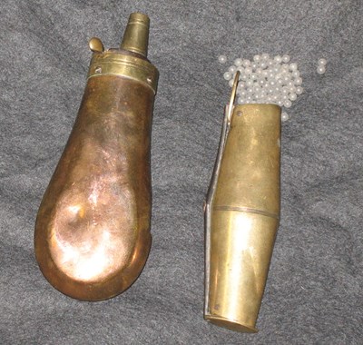 Lot 143 - A BRASS TWO-WAY SHOT-CHARGER