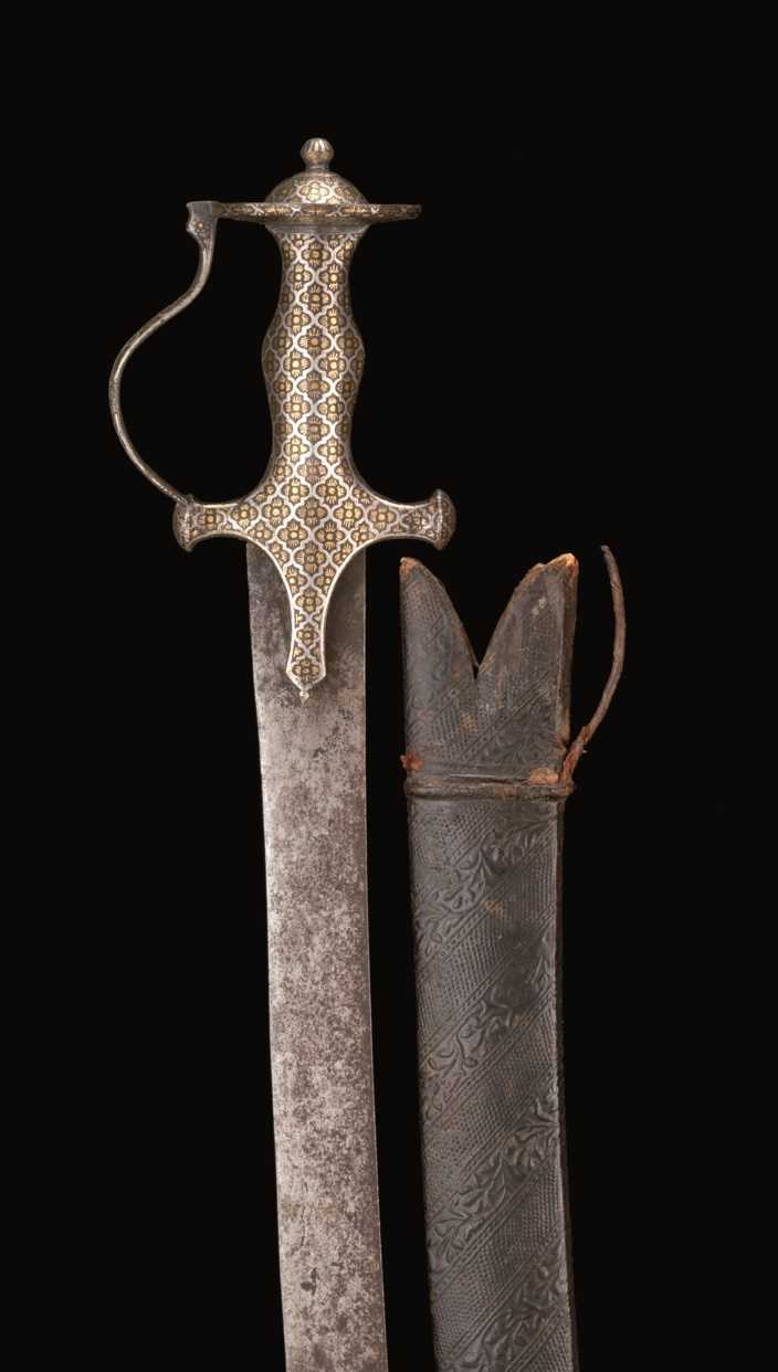 Talwar Locket Lot 19 - AN INDIAN TALWAR WITH DECORATED HILT