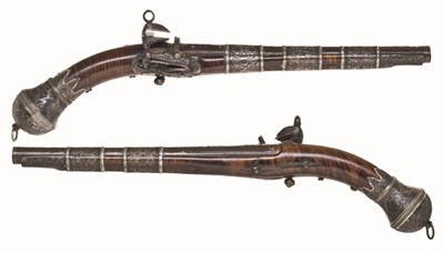Lot 107 - A PAIR OF CAUCASIAN SILVER-MOUNTED MIQUELET-LOCK PISTOLS