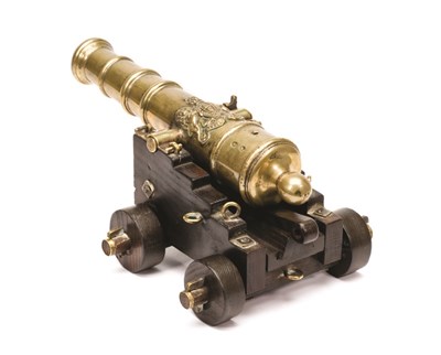 Lot 317 - AN ENGLISH BRONZE MINIATURE CANNON