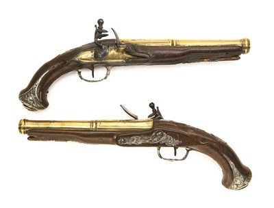 Lot 587 - **A PAIR OF 25 BORE FRENCH SILVER-MOUNTED FLINTLOCK PISTOLS BY CASSAIGNARD A NANTES