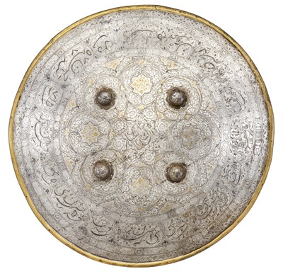 Lot 88 - **AN INDO PERSIAN (DHAL) AND A PARRYING SHIELD (MADU)