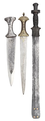 Lot 99 - **TWO INDIAN DAGGERS AND AN INDIAN NAGA SWORD (DAO)