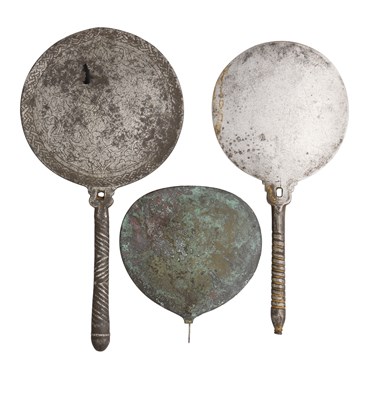 Lot 126 - **TWO MAMLUK STEEL HAND-MIRRORS AND PART OF A ROMAN BRONZE HAND-MIRROR