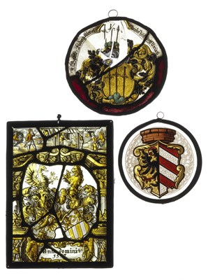Lot 176 - **THREE GERMAN STAINED GLASS ARMORIAL PANELS