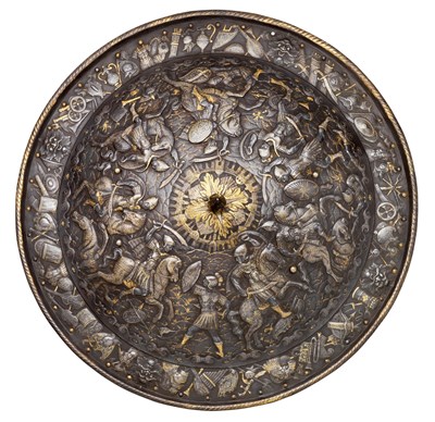Lot 316 - **A STEEL TARGET WITH EMBOSSED AND GOLD-DAMASCENED DECORATION