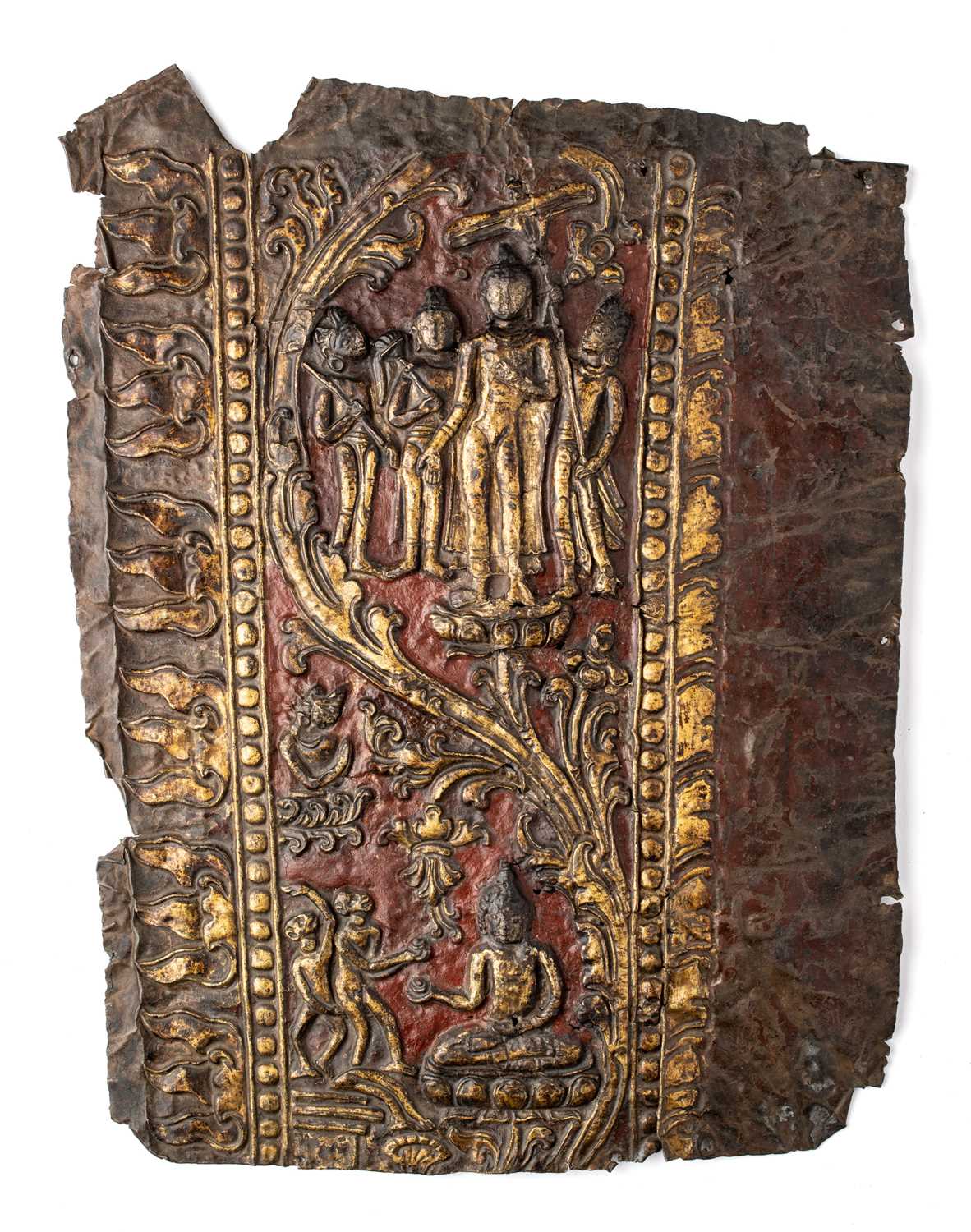 Lot 39 - A COPPER REPOUSSE FRAGMENT FROM A SHRINE