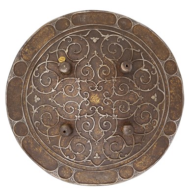 Lot 59 - â€¡ AN UNUSUAL INDIAN CIRCULAR IRON SHIELD (DHAL) OF SIEGE WEIGHT