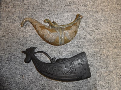 Lot 102 - â€¡ A CARVED HARDWOOD FLASK AND AN INDIAN METAL FLASK