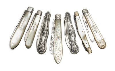 Lot 147 - FOUR MOTHER-OF-PEARL AND SILVER FOLDING FRUIT KNIVES, VARIOUS MAKERS, SHEFFIELD, 1882-1906