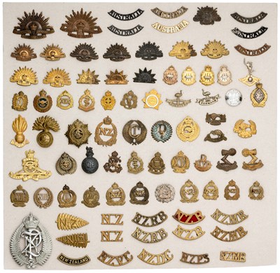 Lot 392 - A GROUP OF AUSTRALIAN AND NEW ZEALAND CAP-BADGES AND SHOULDER-TITLES