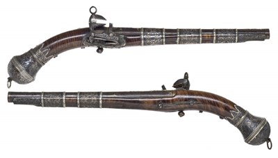 Lot 60 - A PAIR OF CAUCASIAN SILVER-MOUNTED MIQUELET-LOCK PISTOLS