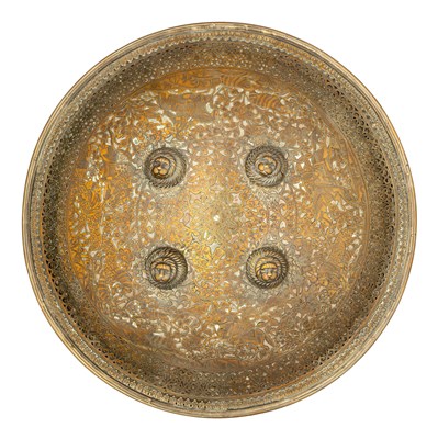 Lot 95 - A NORTH INDIAN HIGHLY DECORATED COPPER ALLOY SHIELD (DHAL), 19TH CENTURY, PROBABLY RAJPUT