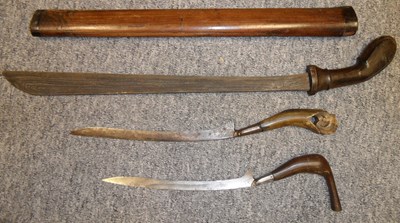 Lot 32 - THREE SOUTHEAST ASIAN EDGED WEAPONS