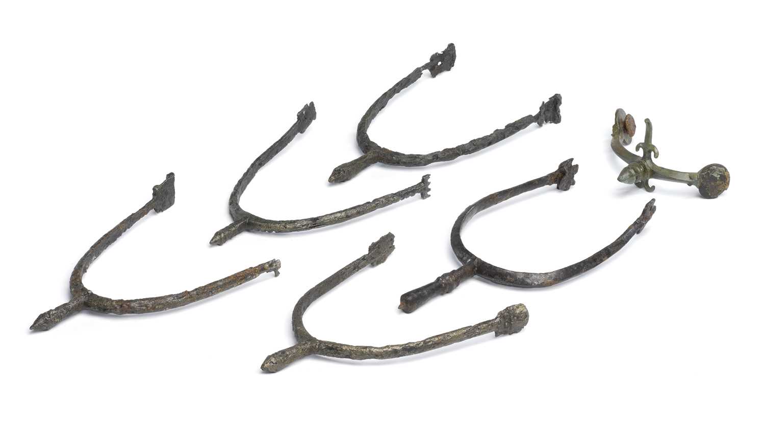 Lot 208 - A ROMAN MILITARY SPUR AND FIVE PRICK SPURS