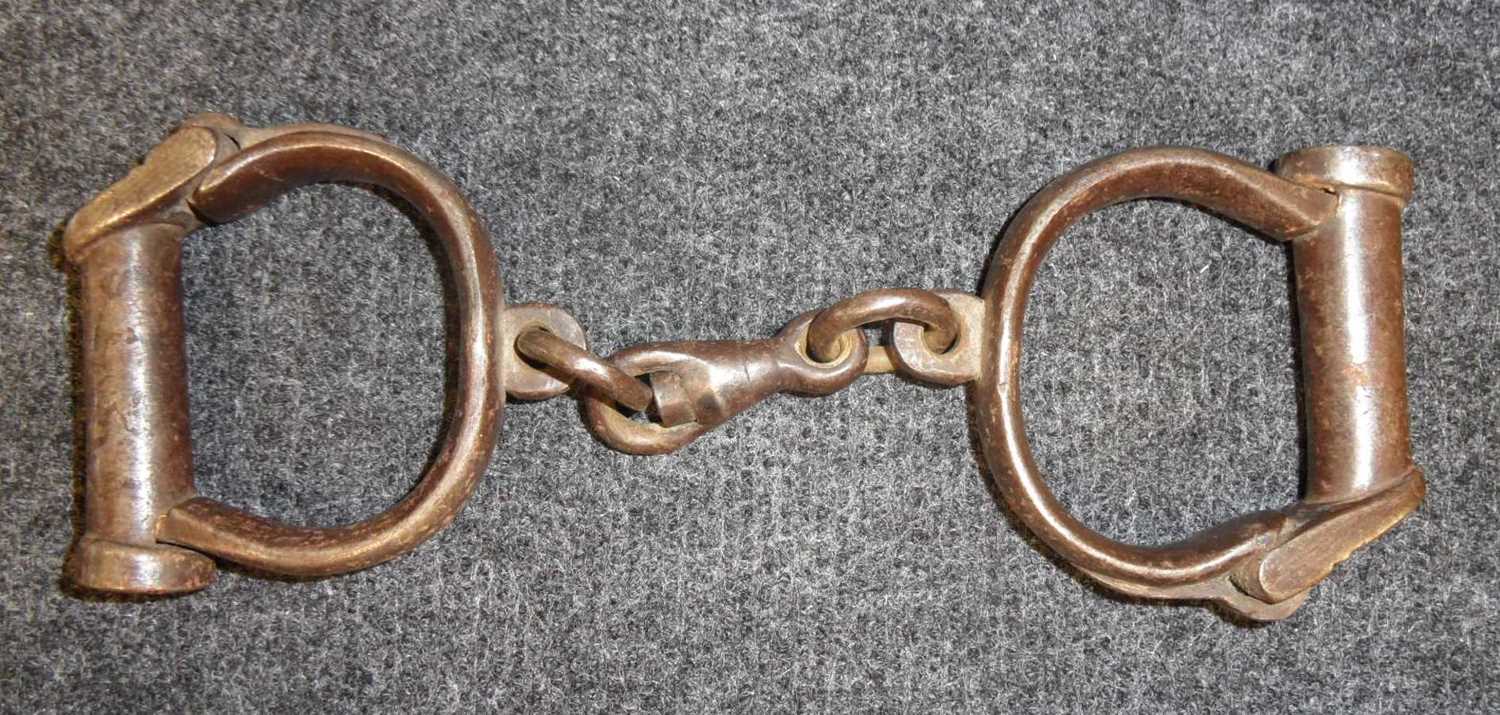 Lot 241 - A PAIR OF VICTORIAN HANDCUFFS