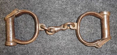 Lot 241 - A PAIR OF VICTORIAN HANDCUFFS