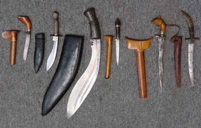 Lot 128 - A NEPALESE GURKHA KUKRI KNIFE AND FIVE SOUTHEAST ASIAN DAGGERS