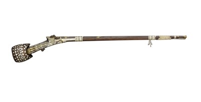 Lot 220 - A FINE 22 BORE INDO-ARAB SILVER AND SILVER-GILT MOUNTED MATCHLOCK RIFLE