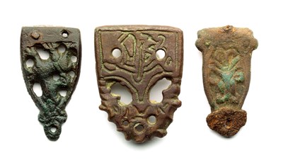 Lot 236 - A COLLECTION OF LATE VIKING AND SAXON COPPER-ALLOY MOUNTS FOR STIRRUP SUSPENSION-STRAPS