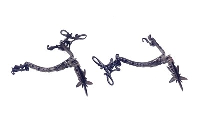 Lot 363 - a pair of steel rowel spurs
