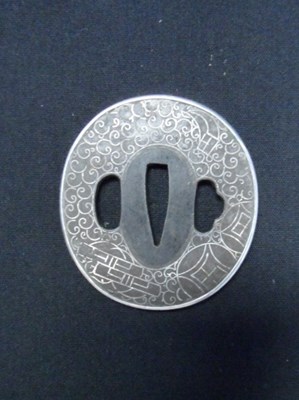 Lot 46 - A JAPANESE SWORD GUARD (TSUBA)