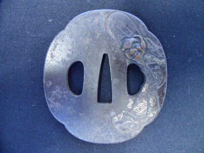 Lot 52 - A JAPANESE SWORD GUARD (TSUBA)