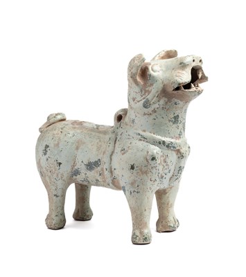 Lot 73 - A CHINESE GREEN-GLAZED POTTERY DOG, EASTERN HAN DYNASTY (25-220AD)