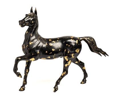 Lot 21 - A CHINESE GOLD-SPLASHED BRONZE PRANCING HORSE, 20TH CENTURY