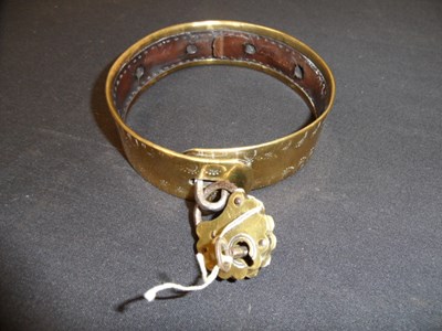 Lot 545 - A BRASS DOG COLLAR, 19TH CENTURY