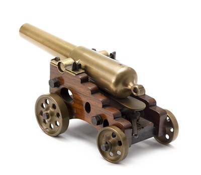 Lot 563 - A MINIATURE BRASS NAVAL CANNON