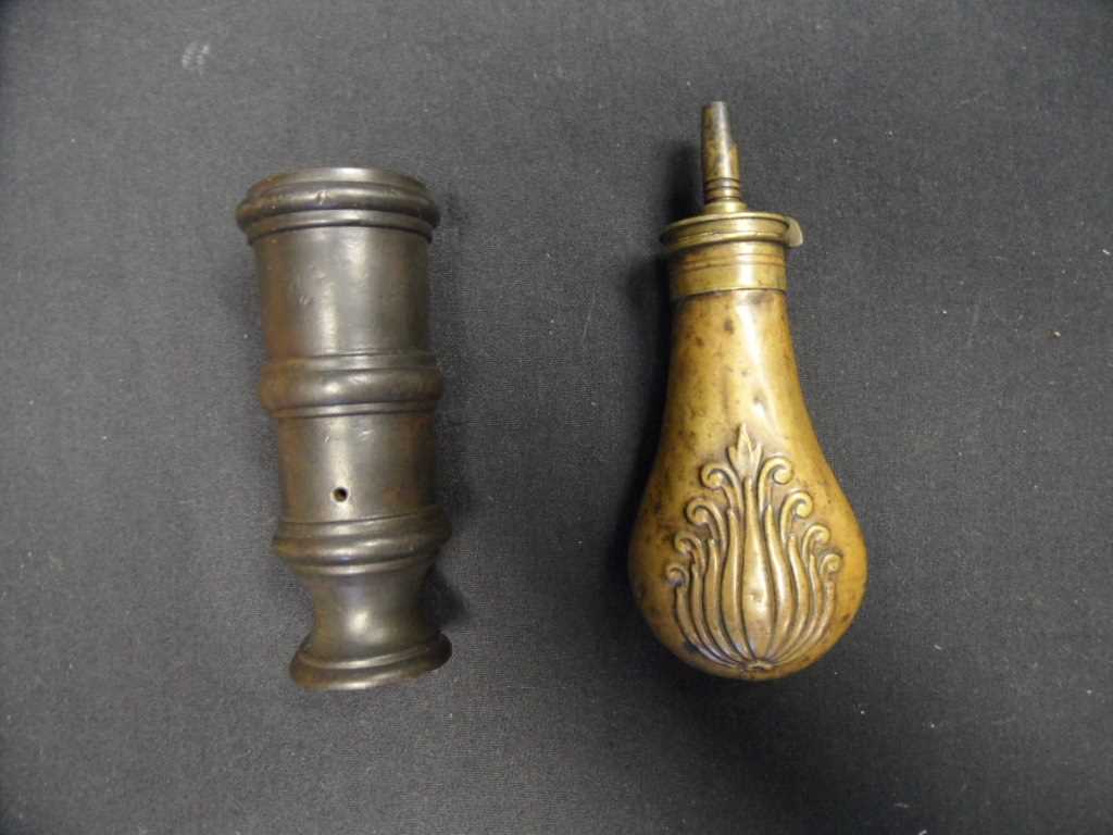 Lot 565 - A BRONZE HAND MORTAR AND A BRASS POWDER-FLASK