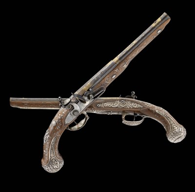 Lot 609 - A PAIR OF FRENCH SILVER-MOUNTED FLINTLOCK HOLSTER PISTOLS FOR PRESENTATION TO AN AFRICAN OR EASTERN