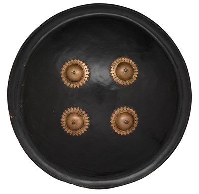 Lot 139 - AN INDO-PERSIAN HIDE SHIELD (DHAL)