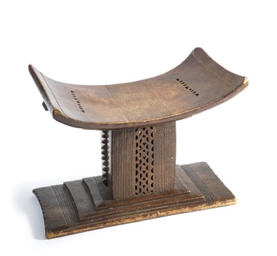 Lot 54 - A CARVED AFRICAN STOOL OF ASHANTI TYPE AND A HIDE BUCKET