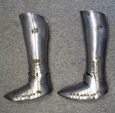 Lot 304 - A PAIR OF SOUTH GERMAN GREAVES AND SABATONS